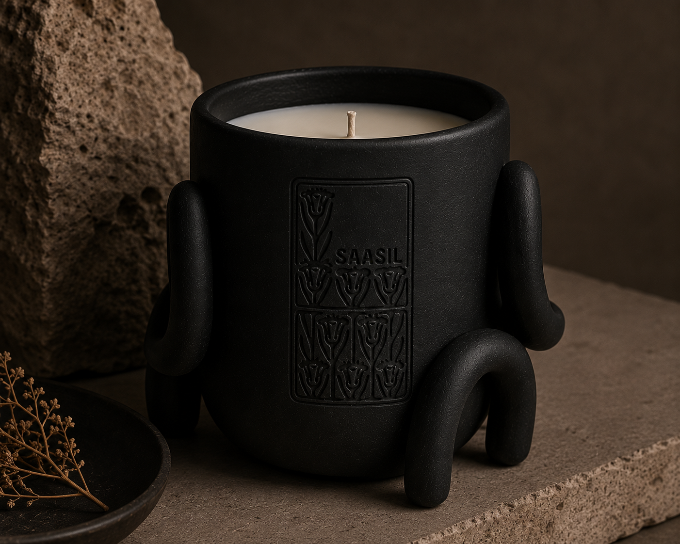 Saasil vessel in the Ash colorway, styled with natural stone and dried botanicals